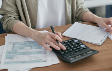 Man using a calculator